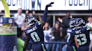 Nov 9, 2025; Seattle, Washington, USA; Seattle Seahawks defensive end DeMarcus Lawrence (0) celebrates after recovering a fumble to score a touchdown during the second quarter against the Arizona Cardinals at Lumen Field. 