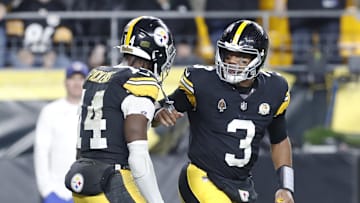 Oct 20, 2024; Pittsburgh, Pennsylvania, USA;  Pittsburgh Steelers wide receiver George Pickens (14) and Pittsburgh Steelers quarterback Russell Wilson (3) celebrate after combining for a touchdown against the New York Jets during the second quarter at Acrisure Stadium. Mandatory Credit: Charles LeClaire-Imagn Images