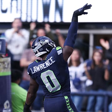 Nov 9, 2025; Seattle, Washington, USA; Seattle Seahawks defensive end DeMarcus Lawrence (0) celebrates after recovering a fumble to score a touchdown during the second quarter against the Arizona Cardinals at Lumen Field. 