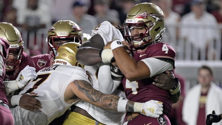 Florida State Seminoles quarterback DJ Uiagalelei is tackled against the Boston College Eagles