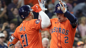 Houston Astros catcher Yainer Diaz (21) celebrates third baseman Alex Bregman (2) home run.
