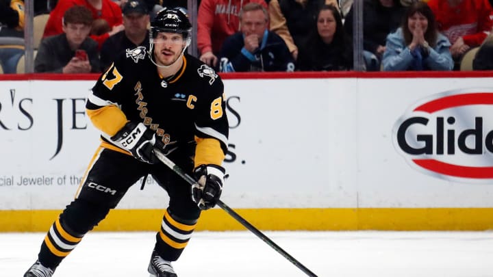 Apr 11, 2024; Pittsburgh, Pennsylvania, USA;  Pittsburgh Penguins center Sidney Crosby (87) skates with the puck against the Detroit Red Wings during the third period at PPG Paints Arena. Mandatory Credit: Charles LeClaire-USA TODAY Sports