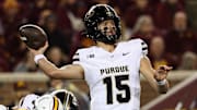 Purdue Boilermakers quarterback Ryan Browne (15) throws the ball