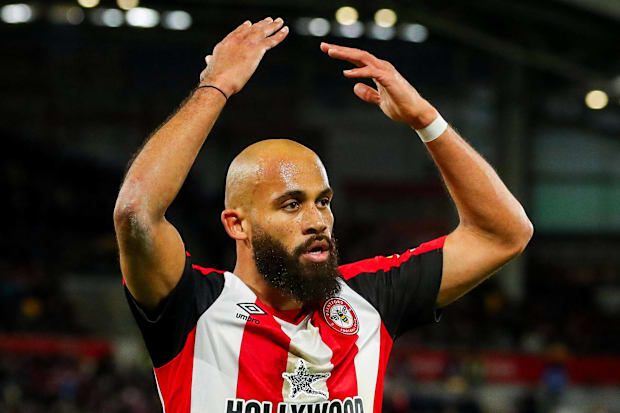 Bryan Mbeumo with arms aloft.