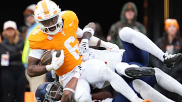 Tennessee running back Dylan Sampson (6) is tackled by the UTEP defense during an NCAA college football game on Saturday, Nov. 23, 2024, in Knoxville, Tenn.