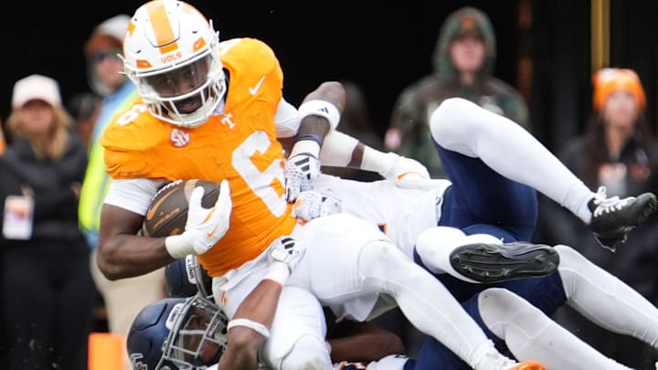 Tennessee running back Dylan Sampson (6) is tackled by the UTEP defense during an NCAA college football game on Saturday, Nov. 23, 2024, in Knoxville, Tenn.