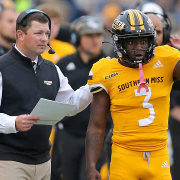 Nov 27, 2021; Hattiesburg, Mississippi, USA; Southern Miss Golden Eagles head coach Will Hall and