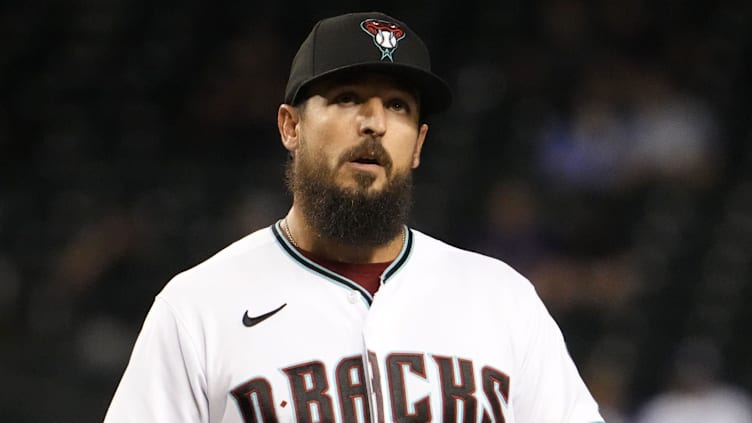 May 26, 2022; Phoenix, Arizona, USA; Arizona Diamondbacks reliever Caleb Smith (22) reacts after Los