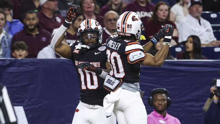 Dec 27, 2023; Houston, TX, USA; Oklahoma State Cowboys wide receiver Rashod Owens (10) celebrates with wide receiver Brennan Presley (80) after scoring a touchdown during the first quarter against the Texas A&M Aggies at NRG Stadium. Mandatory Credit: Troy Taormina-USA TODAY Sports