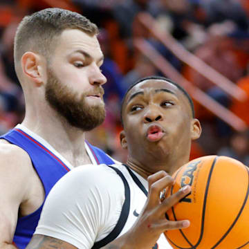 Oklahoma State Cowboys center Brandon Garrison (23) tries to get past Kansas Jayhawks center Hunter Dickinson (1) during a college basketball game between the Oklahoma State University Cowboys (OSU) and the Kansas Jayhawks at Gallagher-Iba Arena in Stillwater, Okla., Tuesday, Jan. 16, 2024.