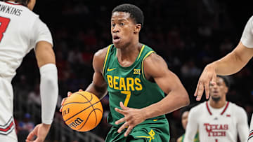 Mar 13, 2025; Kansas City, MO, USA; Baylor Bears guard VJ Edgecombe (7) drives to the basket around Texas Tech Red Raiders guard Elijah Hawkins (3) during the second half at T-Mobile Center. Mandatory Credit: William Purnell-Imagn Images