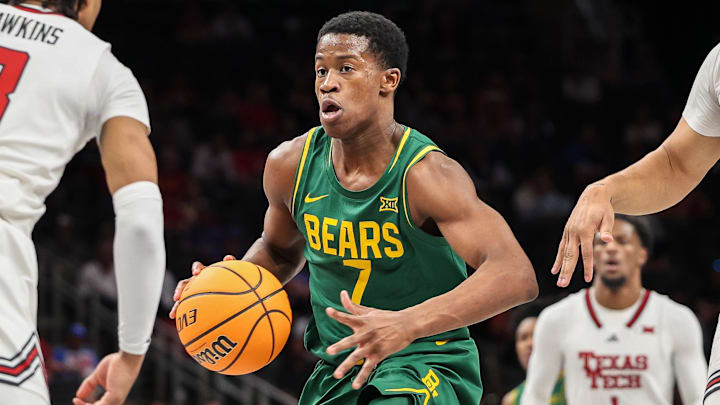 Mar 13, 2025; Kansas City, MO, USA; Baylor Bears guard VJ Edgecombe (7) drives to the basket around Texas Tech Red Raiders guard Elijah Hawkins (3) during the second half at T-Mobile Center. Mandatory Credit: William Purnell-Imagn Images
