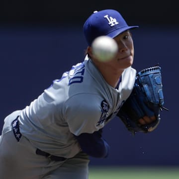 Aug 3, 2025; Tampa, Florida, USA; Los Angeles Dodgers starting pitcher Yoshinobu Yamamoto (18) throws a pitch against the Tampa Bay Rays in the fourth inning at George M. Steinbrenner Field. Mandatory Credit: Nathan Ray Seebeck-Imagn Images