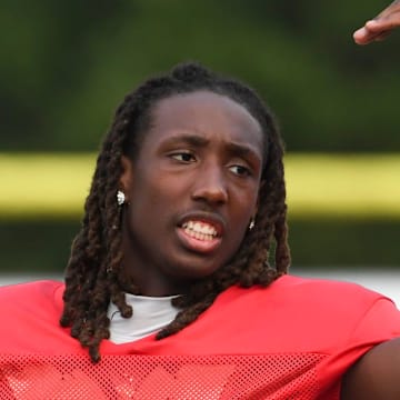Gaffney quarterback Jayvon Gilmore (8) talks to his teammates on the sideline Thursday, Aug. 7, 2025, during a football scrimmage at Gaffney High School in Gaffney, South Carolina.