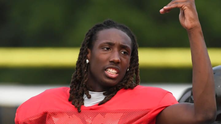 Gaffney quarterback Jayvon Gilmore (8) talks to his teammates on the sideline Thursday, Aug. 7, 2025, during a football scrimmage at Gaffney High School in Gaffney, South Carolina.