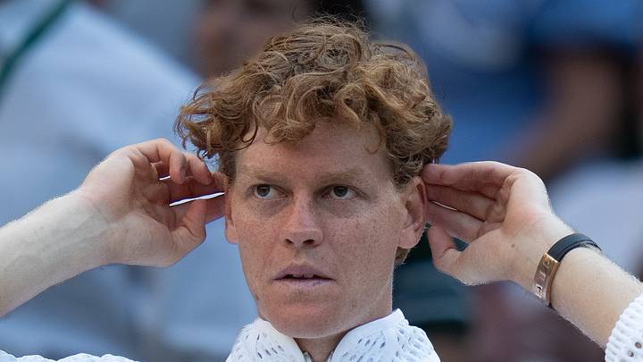 Jannik Sinner reacts after a match
