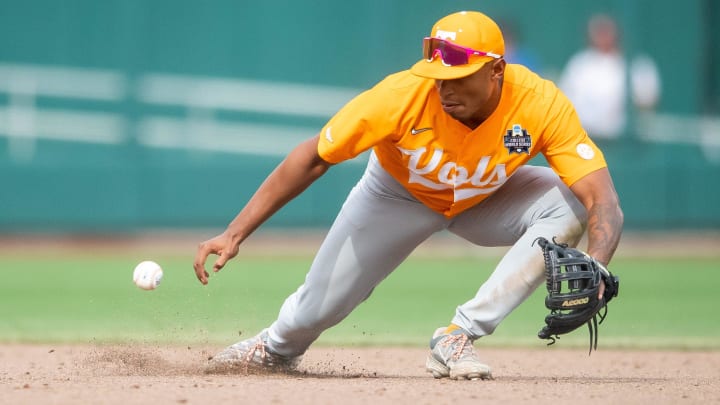 Tennessee's Christian Moore (1) fields the ball during a NCAA College World Series game between Tennessee and Florida State at Charles Schwab Field in Omaha, Neb., on Wednesday, June 19, 2024.