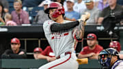 Arkansas Razorbacks shortstop Wehiwa Aloy singles against the LSU Tigers during the eighth inning at Charles Schwab Field on Wednesday at the College World Series.
