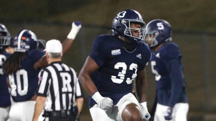 Georgia Southern linebacker Marques Watson-Trent leaps into the air as he celebrates a defensive stand during Saturday's game against Appalachian State.