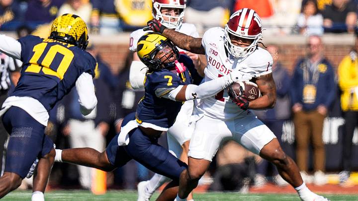 Michigan safety Chris Bracy (7) tackles Indiana running back Turbo Richard (1) during the first half at Michigan Stadium in Ann Arbor on Saturday, Oct. 24, 2026.