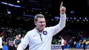 Mar 23, 2025; Seattle, WA, USA;  Arizona Wildcats head coach Tommy Lloyd celebrates after defeating the Oregon Ducks at Climate Pledge Arena. Mandatory Credit: Stephen Brashear-Imagn Images