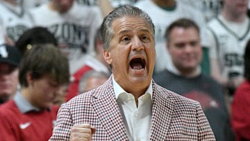 Arkansas Razorbacks coach John Calipari intentionally created a difficult schedule for his team this season. Here, he shouts in a play during the first half Saturday at Michigan State.