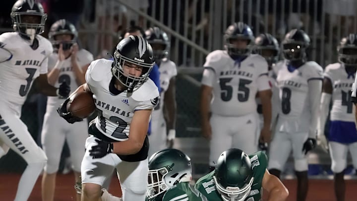 Matanzas' Jordan Schendorf attempts to break a tackle during a game with Flagler Palm Coast at FPC High School, Friday, Nov. 1, 2024. Matanzas' Jordan Schendorf attempts to break a tackle during a game with Flagler Palm Coast at FPC High School, Friday, Nov. 1, 2024.