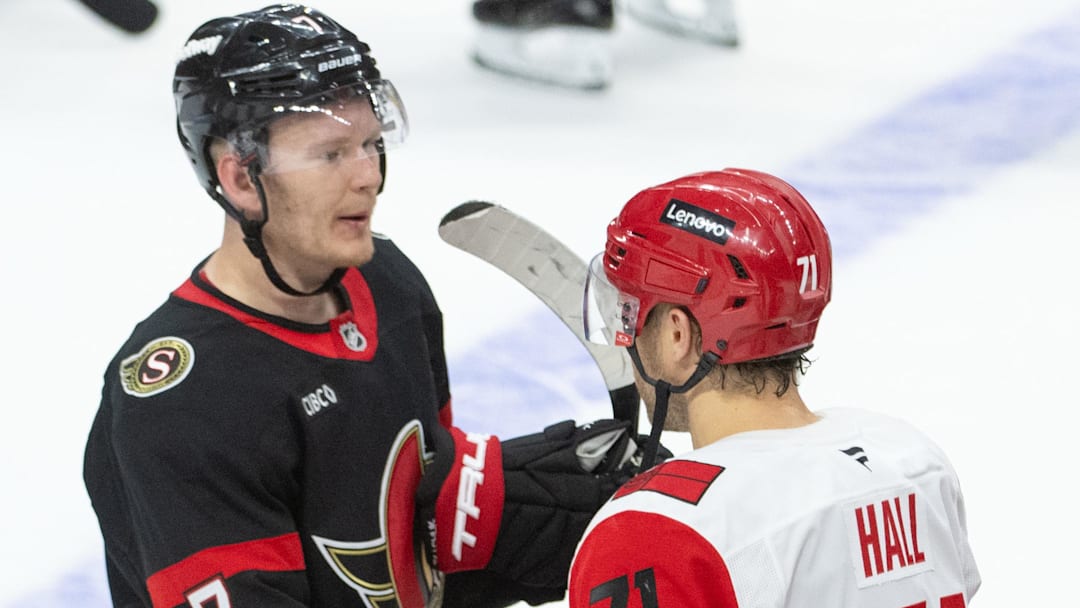 Apr 25, 2026; Ottawa, Ontario, CAN; Ottawa Senators left wing Brady Tkachuk (7) congratulates Carolina Hurricanes left wing Taaylor Hall (71) at the end of game four of the first round of the 2026 Stanley Cup Playoffs at the Canadian Tire Centre. Mandatory Credit: Marc DesRosiers-Imagn