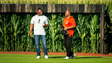 Ken Griffey Jr., left, and his father Ken Griffey Sr. play catch before a Major League Baseball game between the Cincinnati Reds and Chicago Cubs.