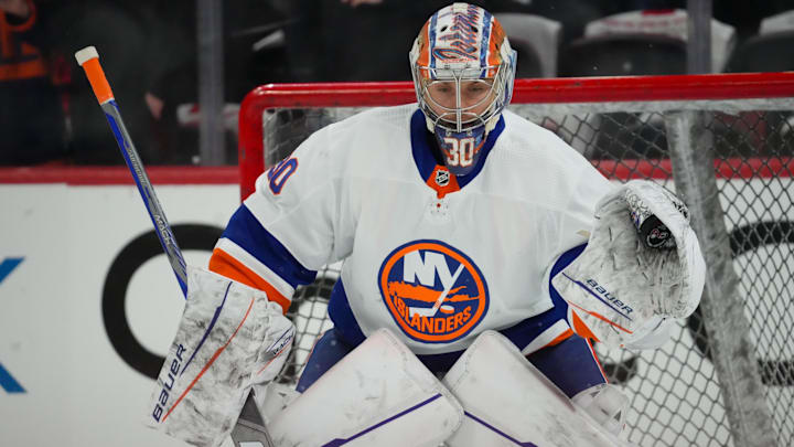 Apr 22, 2024; Raleigh, North Carolina, USA; New York Islanders goaltender Ilya Sorokin (30) watches the shot during the warmups before the game against the Carolina Hurricanes in game two of the first round of the 2024 Stanley Cup Playoffs at PNC Arena. Mandatory Credit: James Guillory-Imagn Images