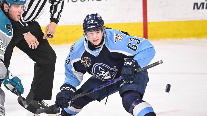 The puck hops away after a faceoff between Milwaukee Admirals center Austin Roest (63) and San Jose Barracuda forward Patrick Giles (54) in the first period of a game Saturday, March 7, 2026, at the UWM Panther Arena in Milwaukee, Wisconsin. The puck hops away after a faceoff between Milwaukee Admirals center Austin Roest (63) and San Jose Barracuda forward Patrick Giles (54) in the first period of a game Saturday, March 7, 2026, at the UWM Panther Arena in Milwaukee, Wisconsin.