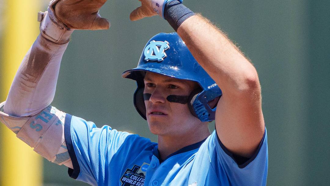 Jun 17, 2026; Omaha, NE, USA; North Carolina Tar Heels center fielder Owen Hull (8) celebrates after driving in a run on a double against the West Virginia Mountaineers during the fourth inning at Charles Schwab Field. Mandatory Credit: Dylan Widger-Imagn Images
