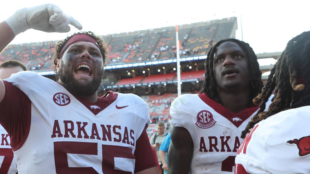 Sep 21, 2024; Auburn, Alabama, USA;  Arkansas Razorbacks offensive lineman Fernando Carmona (55) celebrates with fans after the Razorbacks beat the Auburn Tigers at Jordan-Hare Stadium. Mandatory Credit: John Reed-Imagn Images