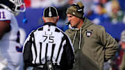 Nov 16, 2025; East Rutherford, New Jersey, USA; New York Giants interim Mike Kafka talks to line judge Mark Stewart (75) during the first quarter against the Green Bay Packers at MetLife Stadium.  