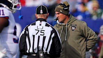 Nov 16, 2025; East Rutherford, New Jersey, USA; New York Giants interim Mike Kafka talks to line judge Mark Stewart (75) during the first quarter against the Green Bay Packers at MetLife Stadium. Mandatory Credit: Vincent Carchietta-Imagn Images