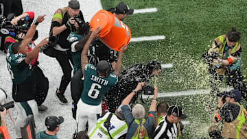 Feb 9, 2025; New Orleans, LA, USA; Philadelphia Eagles head coach Nick Sirianni is dunked with gatorade by wide receiver DeVonta Smith (6) and wide receiver A.J. Brown (11) in the fourth quarter against the Kansas City Chiefs during Super Bowl LIX at Caesars Superdome. Mandatory Credit: James Lang-Imagn Images