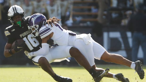 urdue Boilermakers wide receiver Shamar Rigby (16) is tackled by Northwestern Wildcats defensive back Theran Johnson (10) Sat