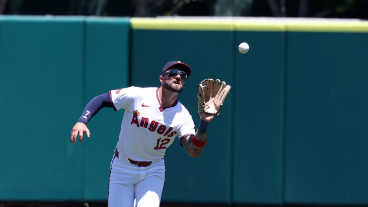 Jul 28, 2024; Anaheim, California, USA;  Los Angeles Angels center fielder Kevin Pillar (12) catches a fly ball during the first inning against the Oakland Athletics at Angel Stadium. Mandatory Credit: Kiyoshi Mio-USA TODAY Sports