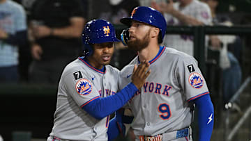 Apr 11, 2025; West Sacramento, California, USA; New York Mets shortstop Francisco Lindor (12) celebrates with outfielder Brandon Nimmo (9) after the Mets scored against the Oakland Athletics during the sixth inning at Sutter Health Park. Mandatory Credit: Ed Szczepanski-Imagn Images