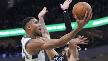 Jan 2, 2025; Milwaukee, Wisconsin, USA; Milwaukee Bucks forward Giannis Antetokounmpo (34) drives to the basket against Brooklyn Nets forward Jalen Wilson (22) in the first half at Fiserv Forum. Mandatory Credit: Michael McLoone-Imagn Images