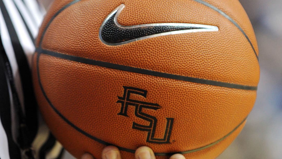 Nov 27, 2012; Tallahassee, FL, USA; An official holds a Florida State Seminoles basketball with logo during the game against the Minnesota Golden Gophers at the Donald L. Tucker Center. Mandatory Credit: Melina Vastola-Imagn Images