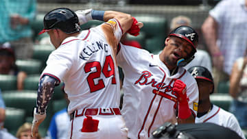 Braves center fielder Jarred Kelenic (24) celebrates with shortstop Orlando Arcia (11) after a three-run home run against the Philadelphia Phillies in the second inning at Truist Park. 