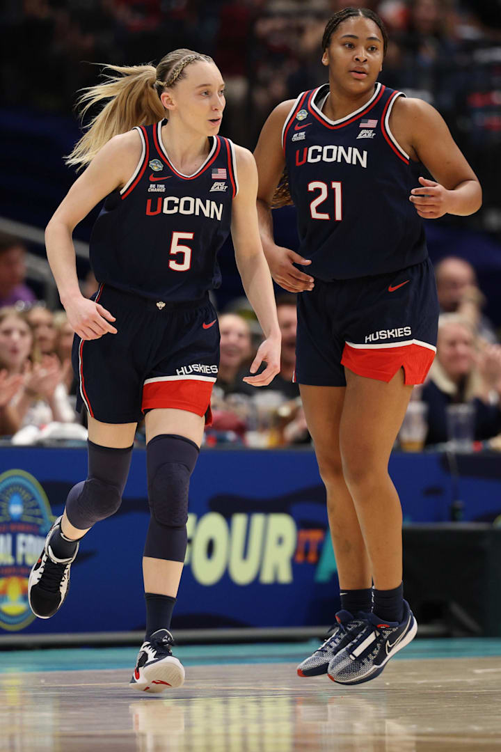 Connecticut Huskies guard Paige Bueckers high fives forward Sarah Strong during the Final Four game against UCLA.  