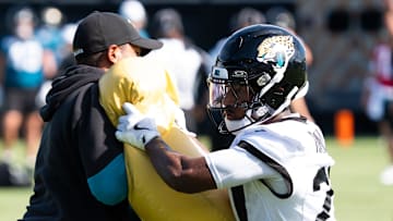 Jacksonville Jaguars cornerback Caleb Ransaw (27) hits a tackling pad during the Jacksonville Jaguars’ third mandatory minicamp Thursday June 12, 2025 at the Miller Electric Center in Jacksonville, Fla. [Doug Engle/Florida Times-Union]