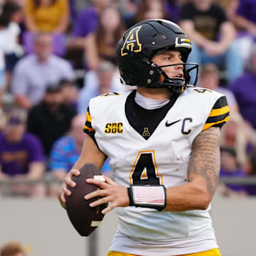 Sep 14, 2024; Greenville, North Carolina, USA;  Appalachian State Mountaineers quarterback Joey Aguilar (4) looks down field against the East Carolina Pirates during the second half at Dowdy-Ficklen Stadium. Mandatory Credit: James Guillory-Imagn Images
