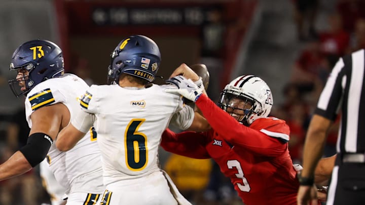 Sep 7, 2024; Tucson, Arizona, USA; Arizona Wildcats defensive lineman Tre Smith (3) forces Northern Arizona Lumberjack quarterback Ty Pennington (6) to fumble the ball during the fourth quarter at Arizona Stadium. Mandatory Credit: Aryanna Frank-Imagn Images
