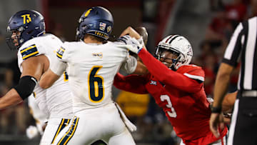 Sep 7, 2024; Tucson, Arizona, USA; Arizona Wildcats defensive lineman Tre Smith (3) forces Northern Arizona Lumberjack quarterback Ty Pennington (6) to fumble the ball during the fourth quarter at Arizona Stadium. 