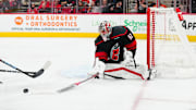 Nov 5, 2024; Raleigh, North Carolina, USA;  Carolina Hurricanes goaltender Pyotr Kochetkov (52) comes out and pokes the puck away against the Philadelphia Flyers during the second period at Lenovo Center. Mandatory Credit: James Guillory-Imagn Images