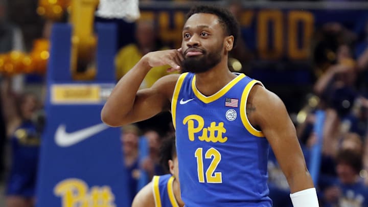 Feb 17, 2024; Pittsburgh, Pennsylvania, USA;  Pittsburgh Panthers guard KJ Marshall (12) reacts after making a three point basket against the Louisville Cardinals during the second half at the Petersen Events Center. Pittsburgh won 86-59. Mandatory Credit: Charles LeClaire-Imagn Images