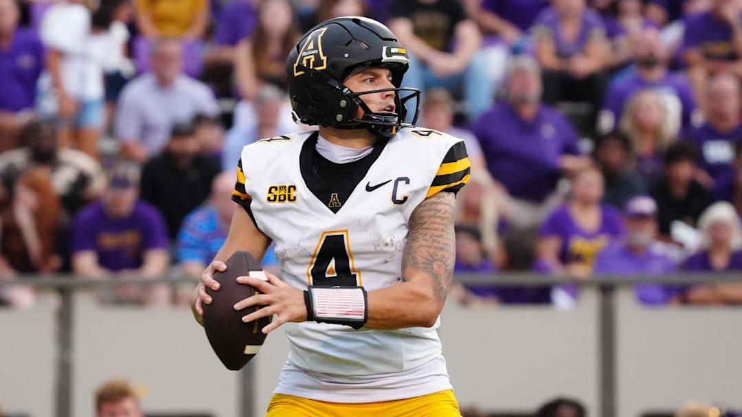 Sep 14, 2024; Greenville, North Carolina, USA;  Appalachian State Mountaineers quarterback Joey Aguilar (4) looks down field against the East Carolina Pirates during the second half at Dowdy-Ficklen Stadium. Mandatory Credit: James Guillory-Imagn Images